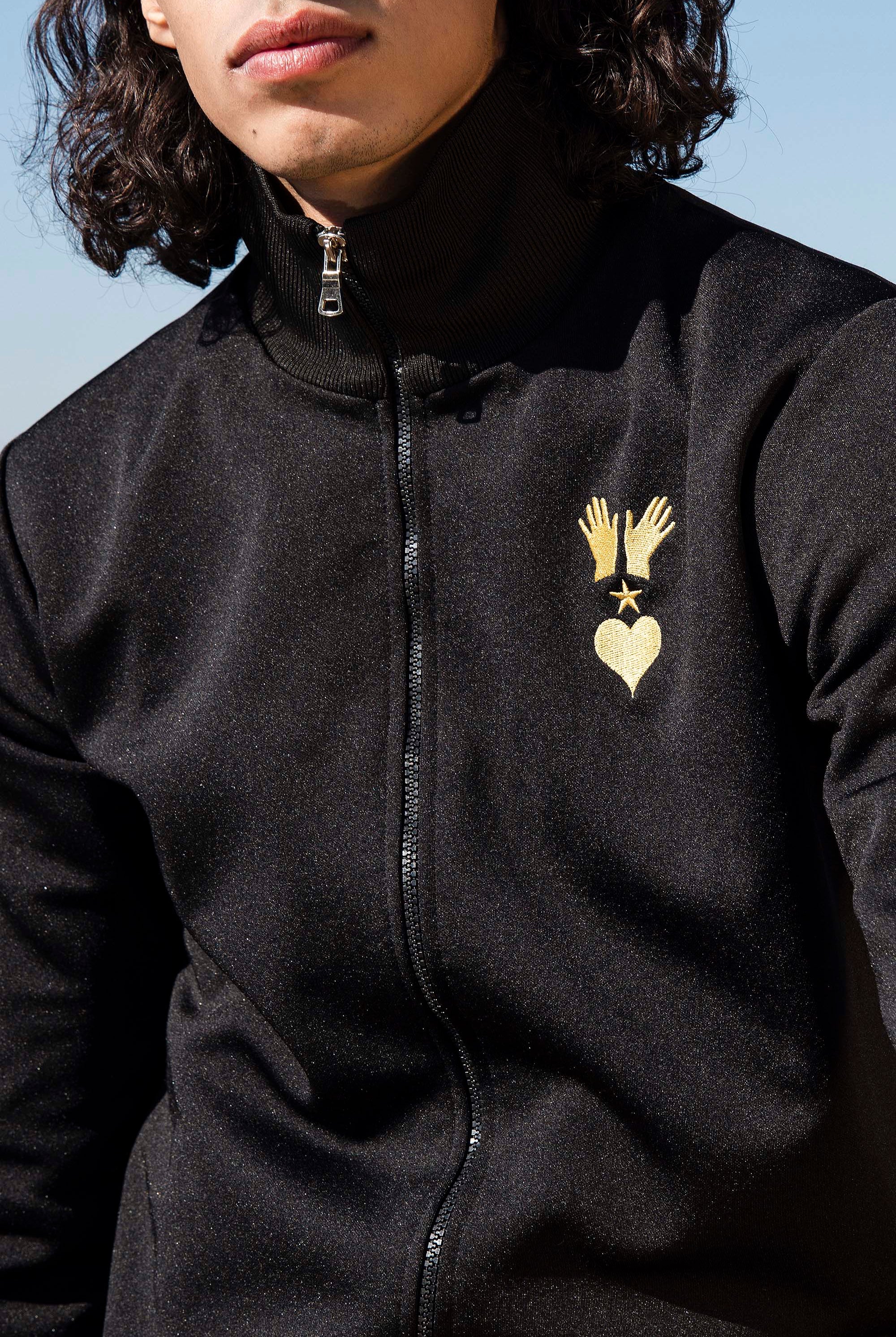 Veste de Sport Orgullo Manos Noir veste de sport pour dynamiser une tenue décontractée