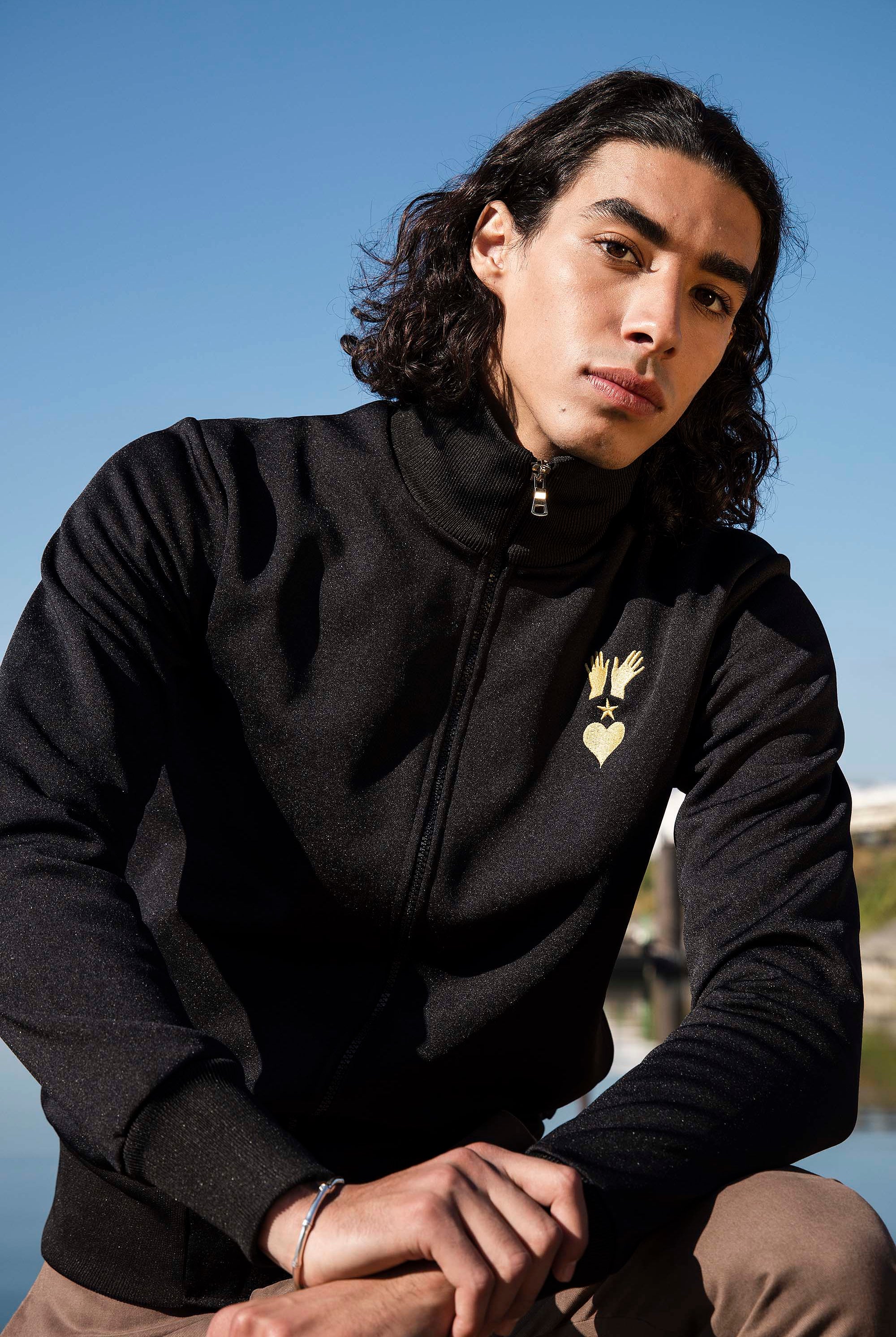 Veste de Sport Orgullo Manos Noir veste de sport pour dynamiser une tenue décontractée