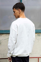 Sweatshirt Angelo Rescate Écru Pour un look sportswear et urbain, les sweatshirts Misericordia sont faits pour vous